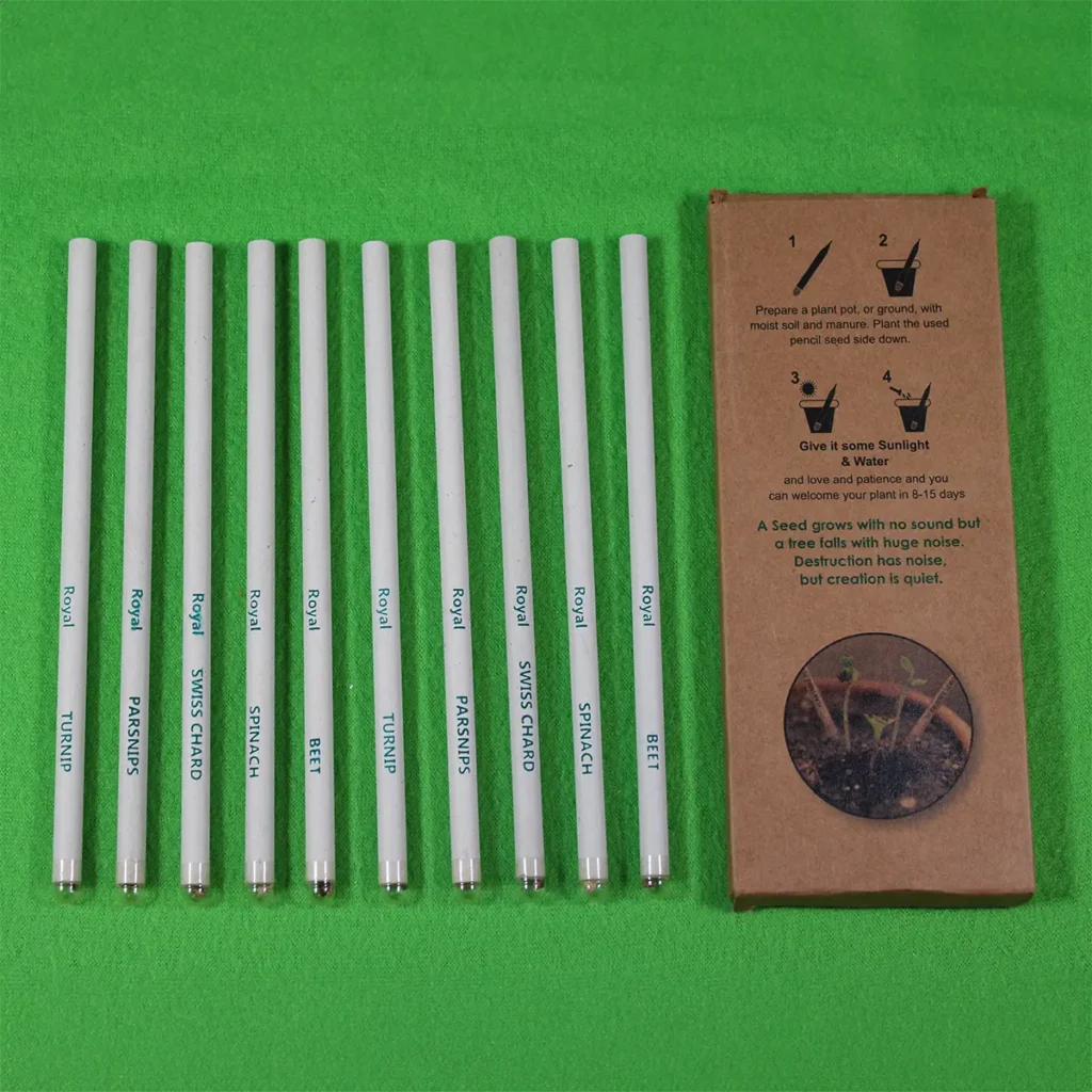 10-pack of Royal Eco Products plantable white paper pencils with colored lead, labeled with vegetable names like turnip, parsnips, swiss chard, spinach, and beet, placed beside eco-friendly packaging on a green background.