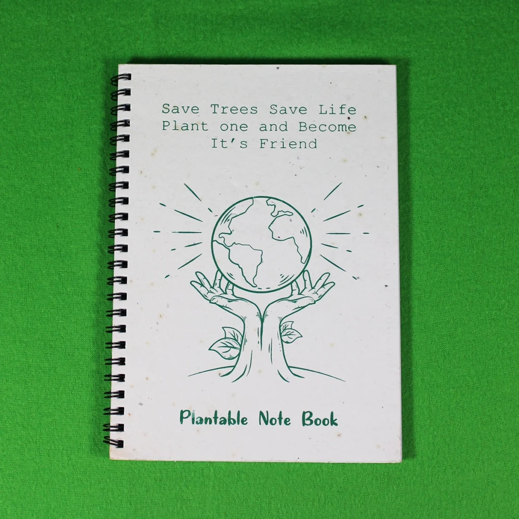 Eco-friendly plantable notebook with Earth and tree illustration on the cover, 22 x 15 cm